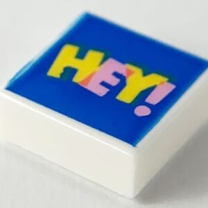 3070pb154 – Tile 1 x 1 with Bright Pink and Yellow 'HEY!' on Blue Background Pattern